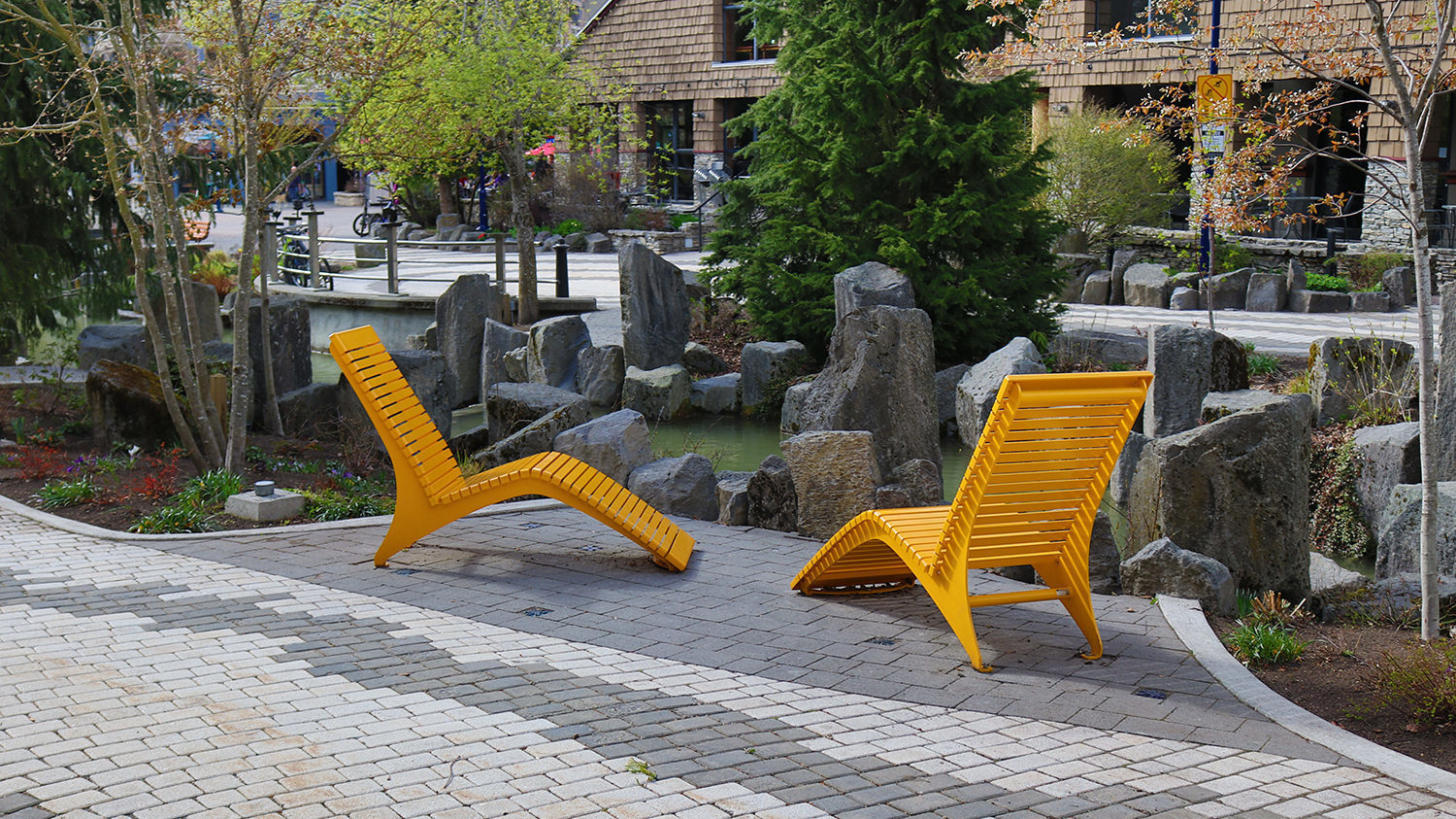 Yellow 720 Chaise Lounge on walkway in Whistler