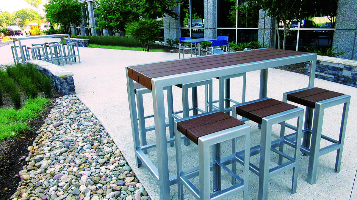 1050 bar height table and stools in outdoor office setting