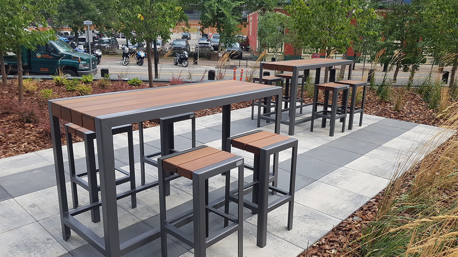 Bar height 1050 table and backless stools in outdoor patio