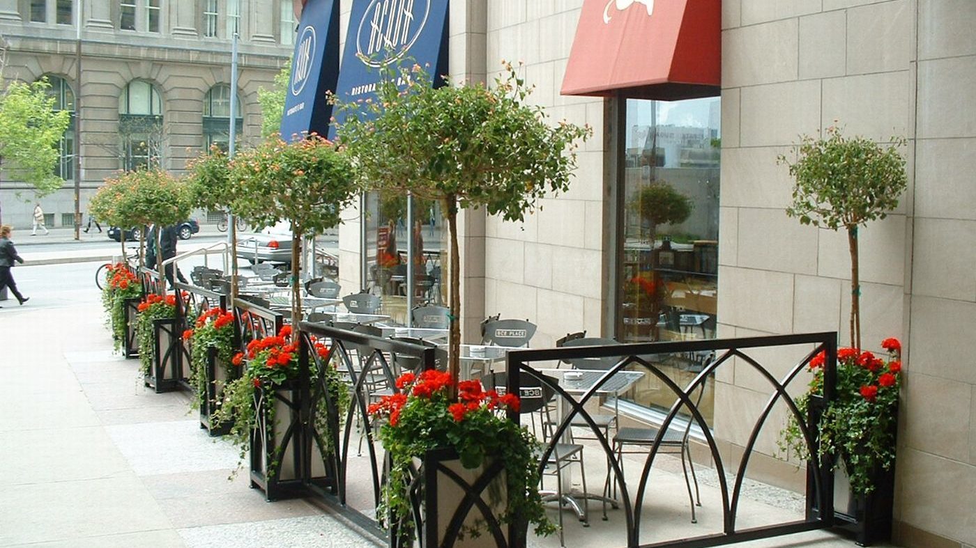 Custom Brookfield Place Planters with red flowers and small trees