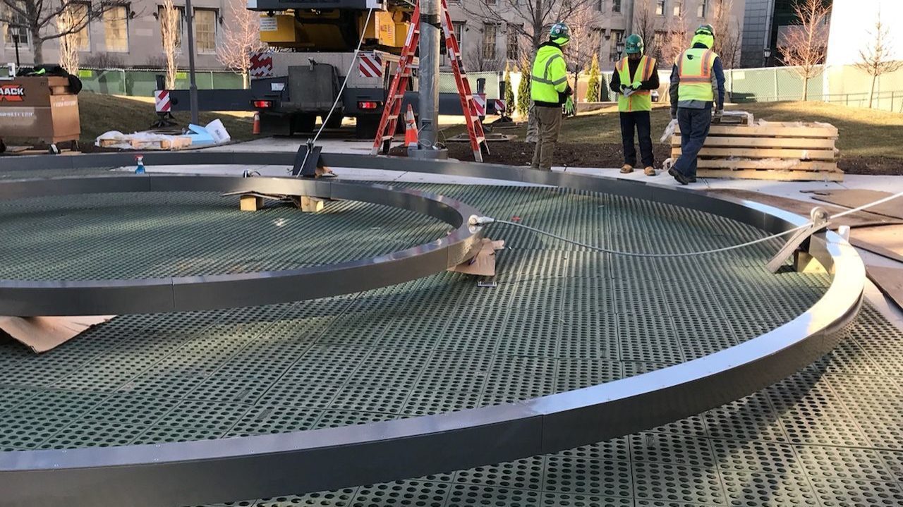 Two circles on the ground with construction workers