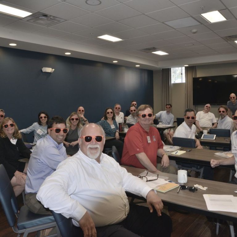 Staff wearing Orange Sunglasses