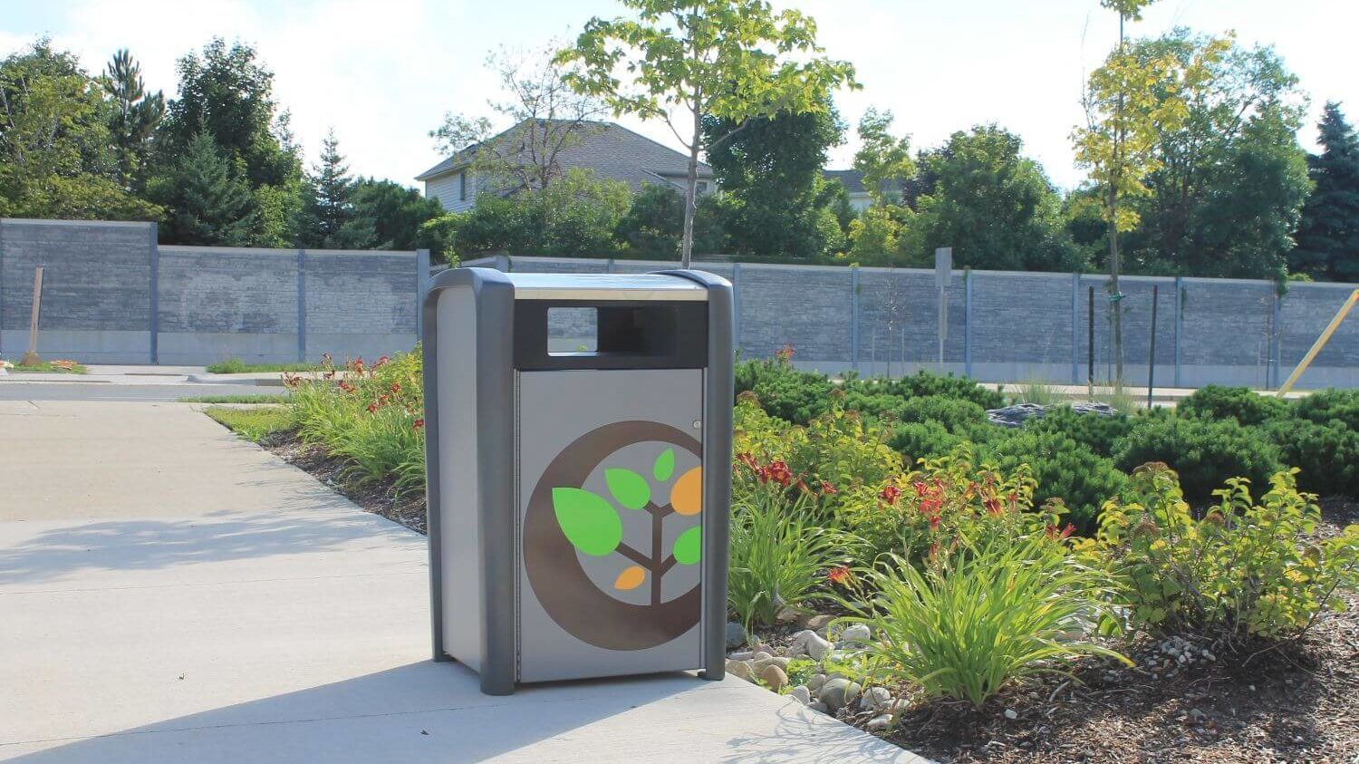 Trash bin outside with gardens