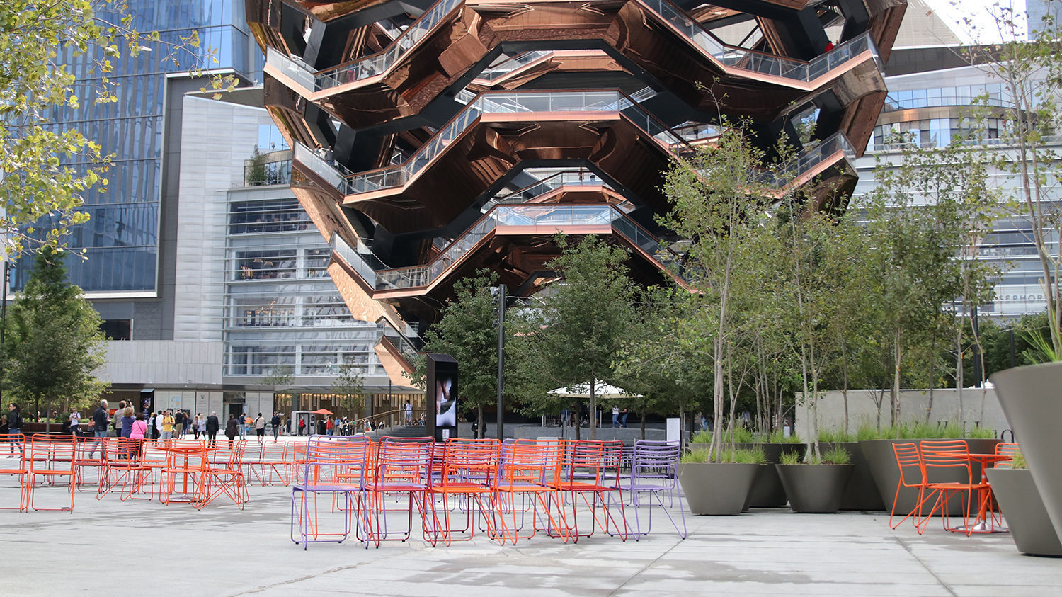 Brightly painted Kontur Chairs looking at the Vessel in NY