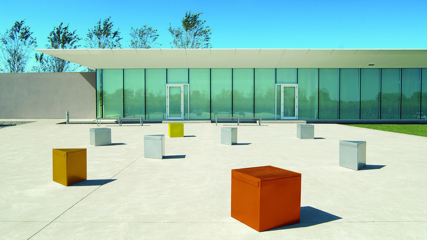 Lexicon steel seating modules in metallic colors in front of a modern building