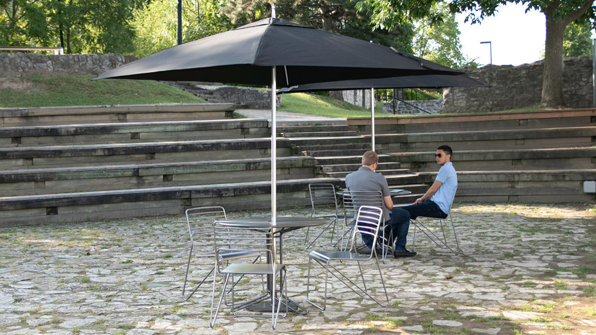 Kontur tables and chairs with Tuuci umbrella