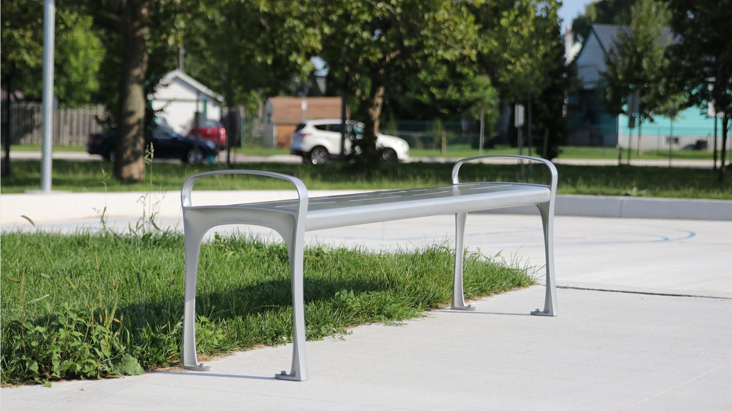 870 Backless Metal Bench in park setting