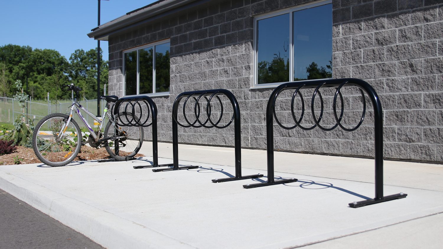 MBR-0300 Bike Racks with bike in front of building