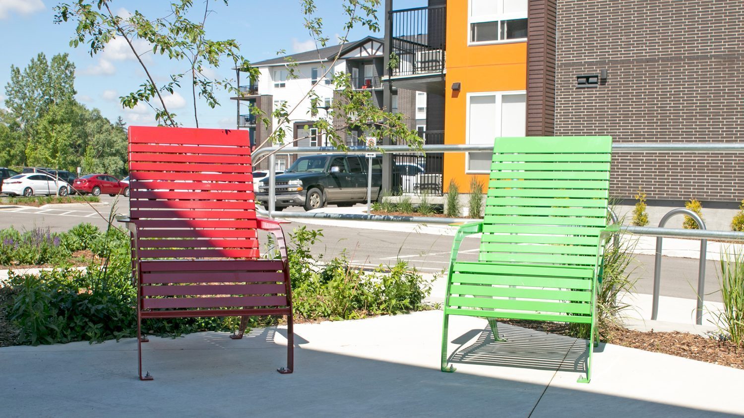 Red and Green powdercoated 720 chairs at apartment complex