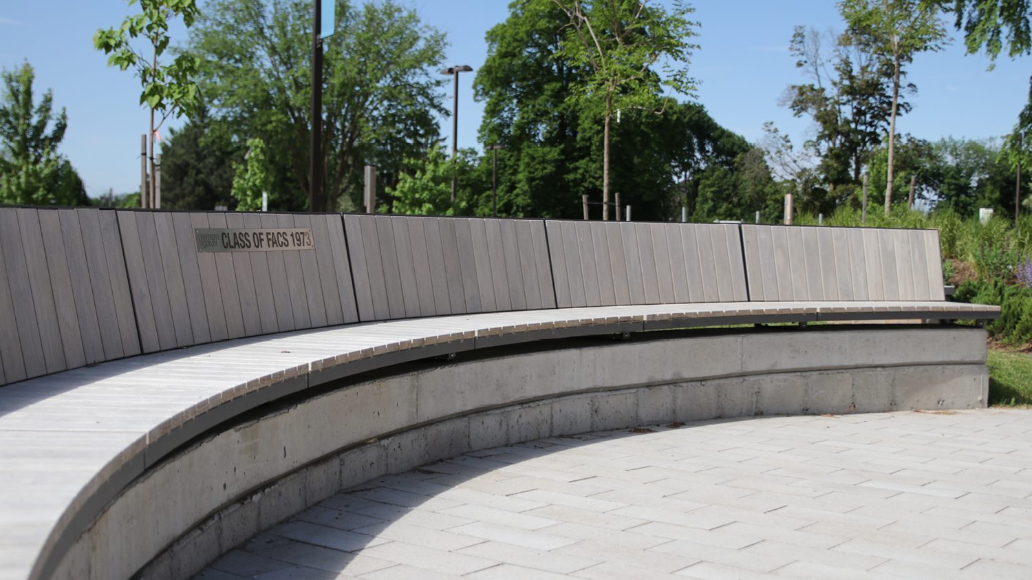 Curved Ogden Bench with custom wood at Lang Plaza