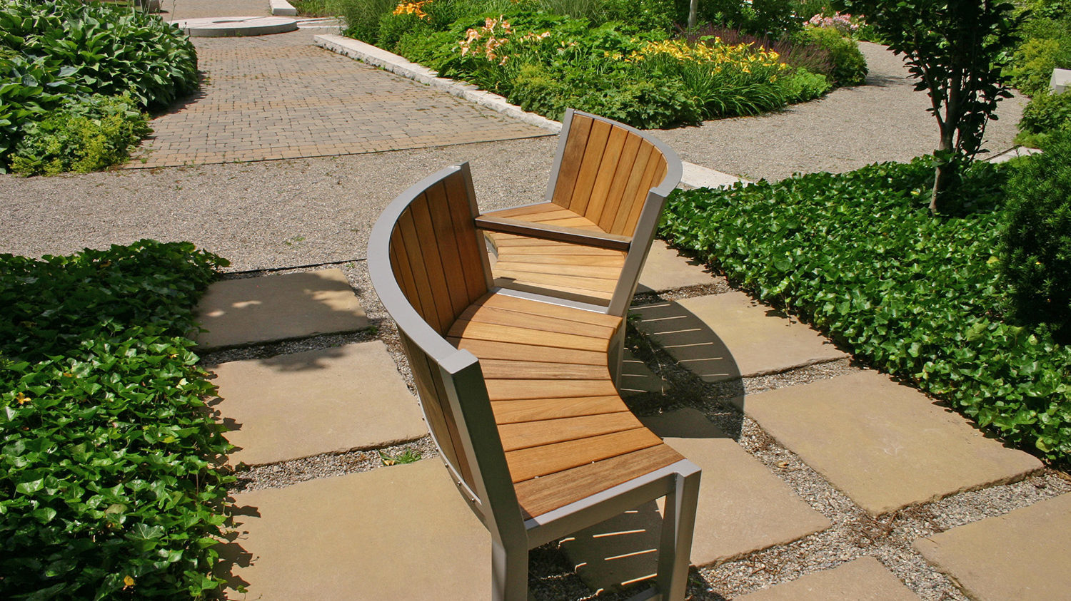 S Bench with facing seats in garden patio