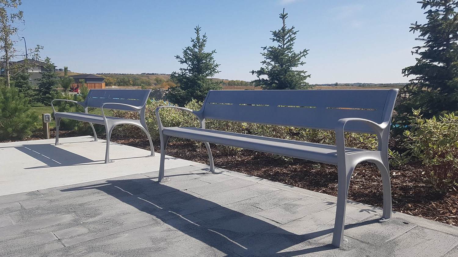 Painted Silver 14 870 backed benches with arms in park setting