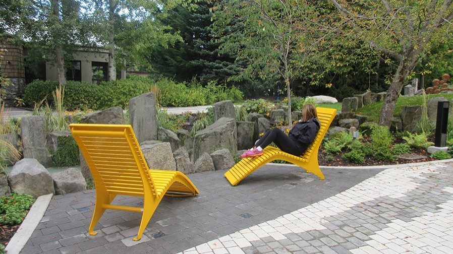 Woman sitting on yellow chair in Whistler BC