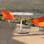 Orange Battery Chairs overlooking a river