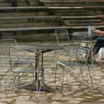 Kontur Cafe Table and Chairs with women wearing white in background