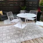 Kontour Collection of Cafe Table and Chairs in White on Patio