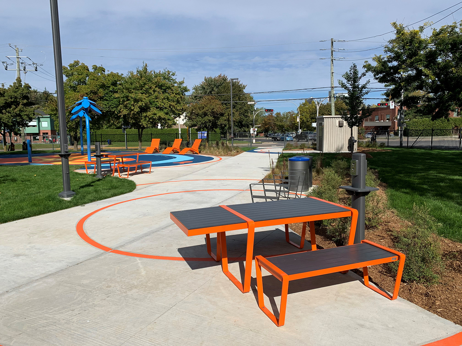 Bright orange Lexicon table with wheelchair accessibility in park