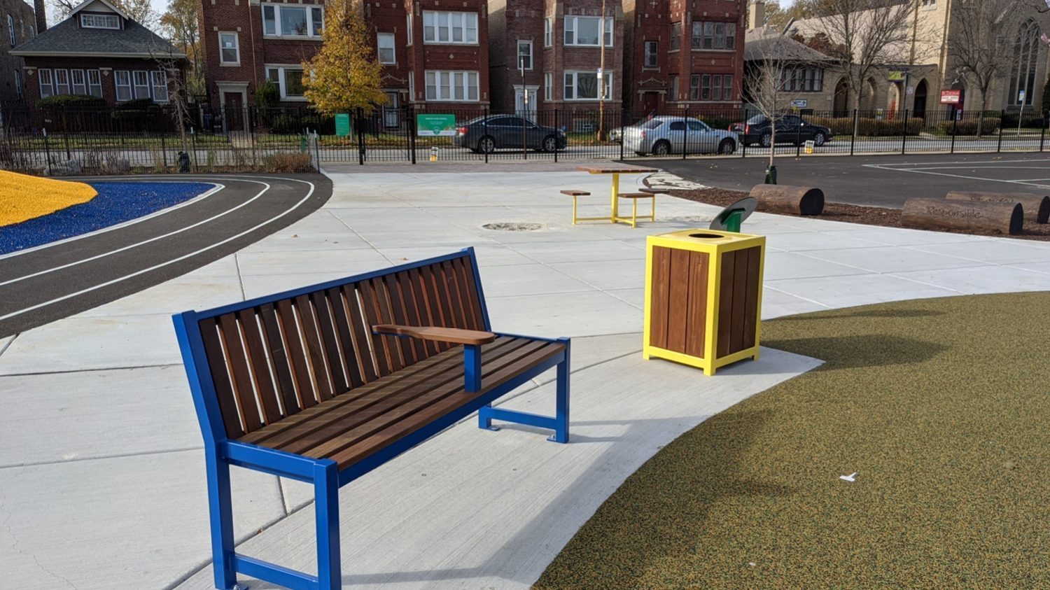 Blue Powdercoat 400 Series Bench with 1050 trash container at school