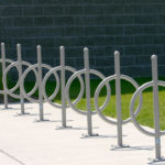 Seven Silver Bike Racks with Surface Mounts