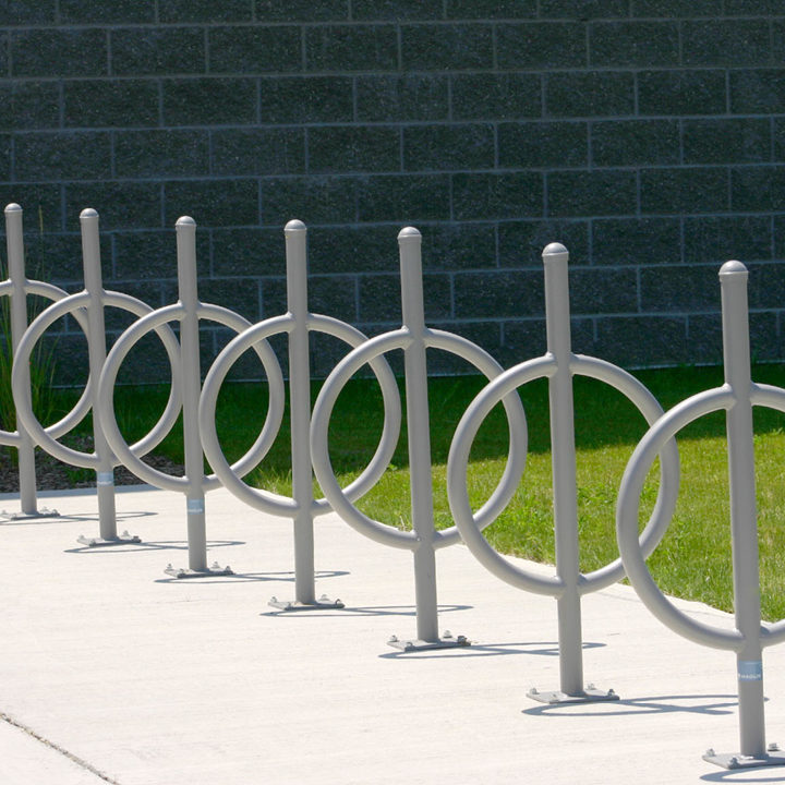 Seven Silver Bike Racks with Surface Mounts