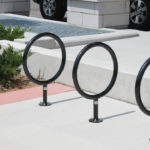 Three black circle bike racks