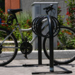 Black Maglin Bike Rack with locked bicycle