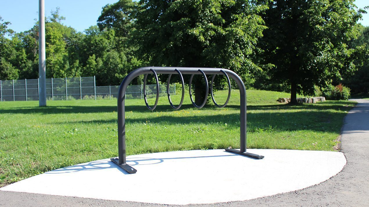 300 Style Bike Rack in park with sun shining and trees