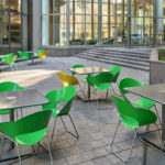 Green and Yellow Battery Chairs outside of Building