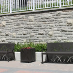 Two Black Metal Benches with Black Small Planter