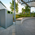 Silver and Green Trash Can outside Building