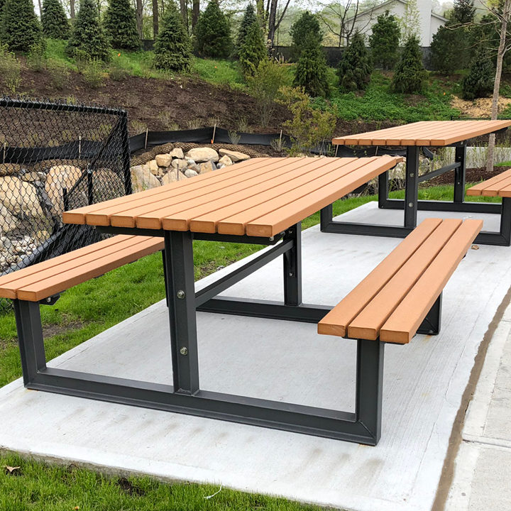 Cedar and Black Metal Picnic Tables near residential area