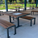 Multiple Table and Benches Under Pavilion Outside