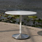 White Circular Cafe Table Near River