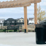 Black Benches and Trash Can Near subdivision