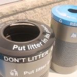 Garbage and Recycling bins with a black and blue top