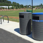 Birch pattern 650 recycle and trash containers at a park