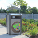 Trash Can outside near Garden