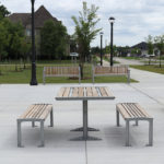 720 cluster seating - table with 2 backless benches in park setting