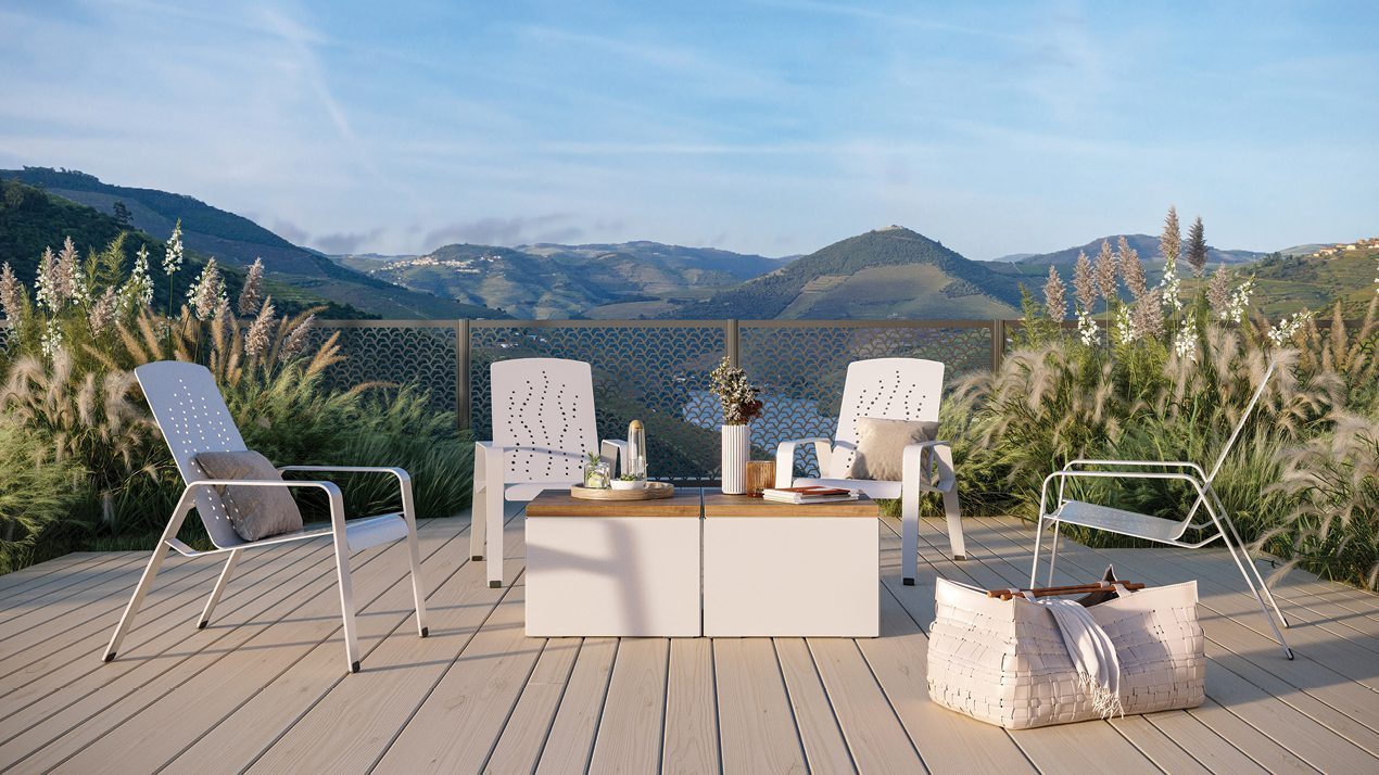 2700 Series - ALUM Lounge chairs with Pixel tables in picturesque mountain setting with beautiful greenery