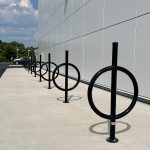 100 Series Bike Rack painted gloss black on sidewalk next to building