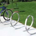 3100 Series - Orbit Stainless Steel Bike Racks with blue bicycle at park