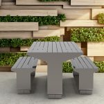 L-Series Tables and Seating next to green planter wall