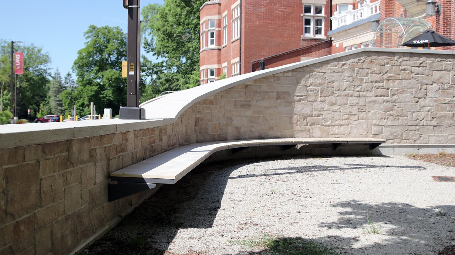 Curved Ogden Cantilever Bench with custom wood at Lang Plaza