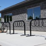 MBR-0300 Bike Rack painted gloss black next to building