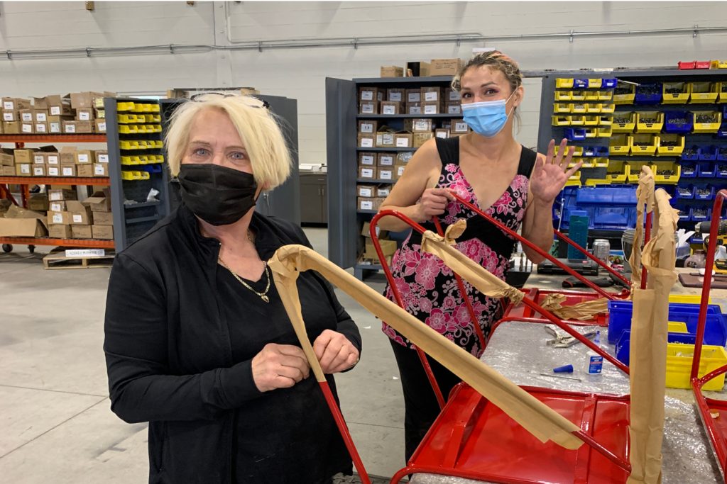 Two Maglin Employees packaging some chairs