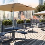 FAVA Cluster Seating with TUUCI umbrellas, wheelchair accessible on rooftop patio