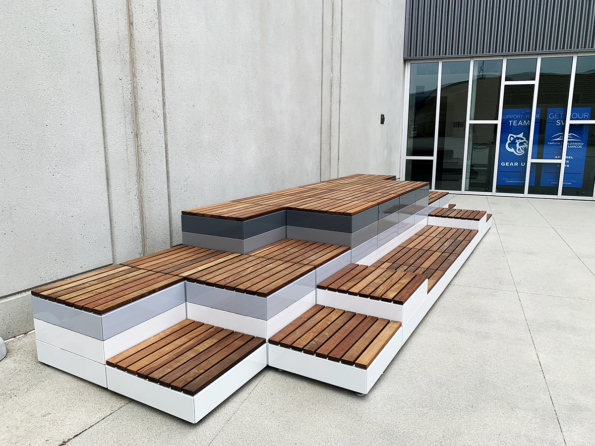 Pixel configuration with gradient blocks, from light to dark grey with ipe wood block tops at CSUSM.