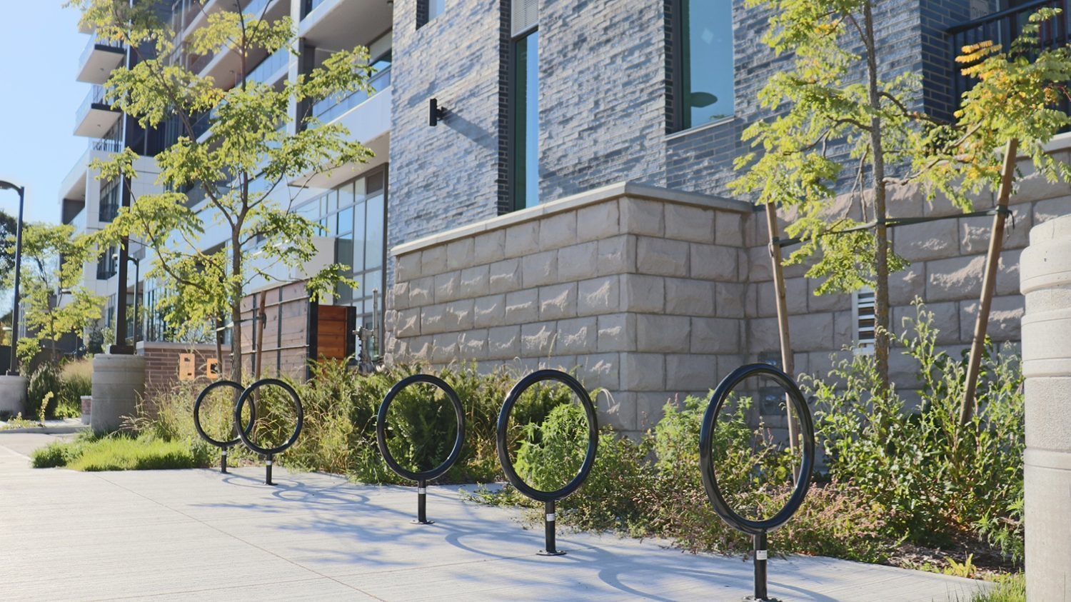 150 Series Bike Racks lined up in front of Metalworks apartment complex