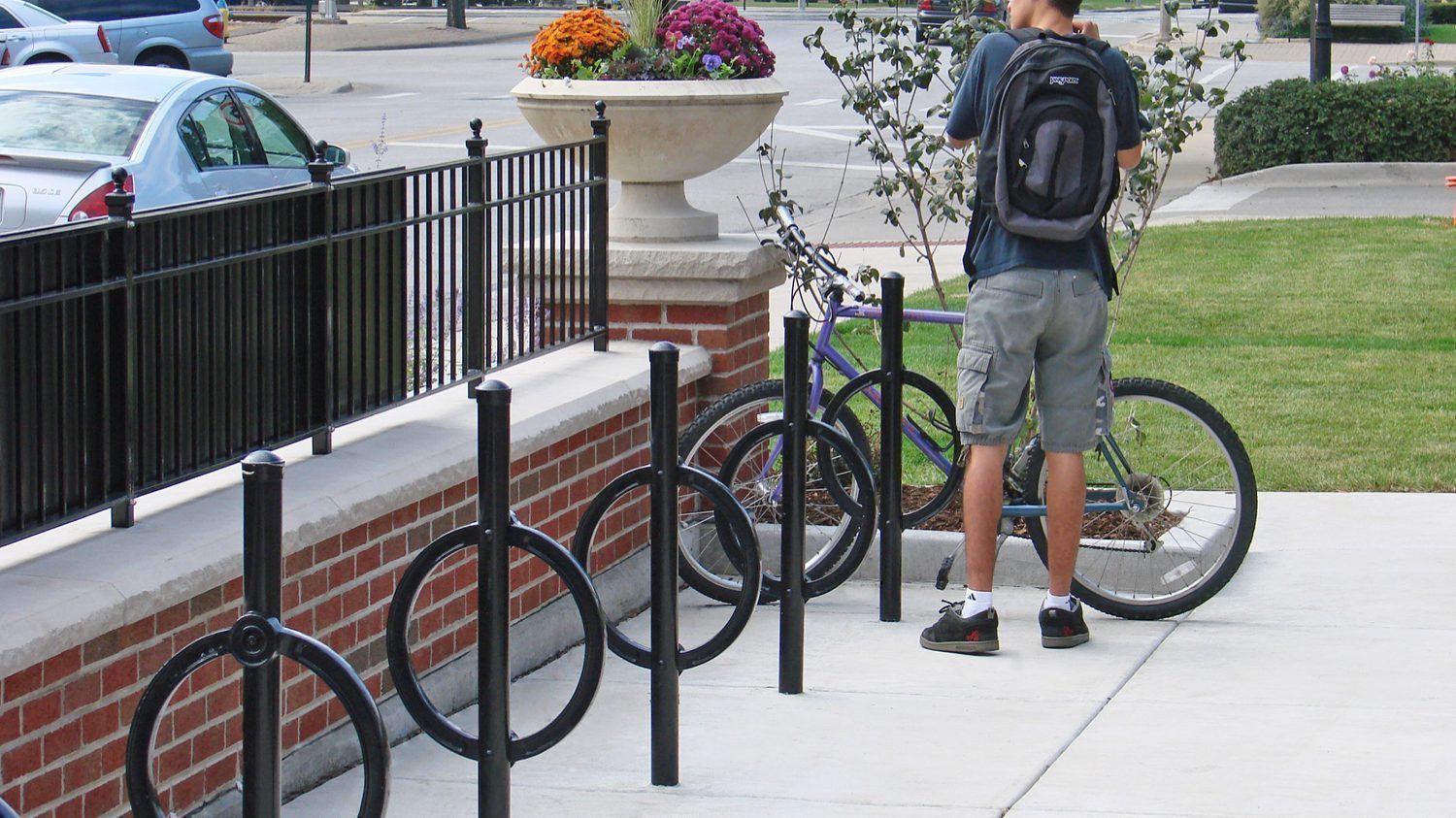 200 Series Bike Racks with man locking bike on Parkridge Main Street, IL