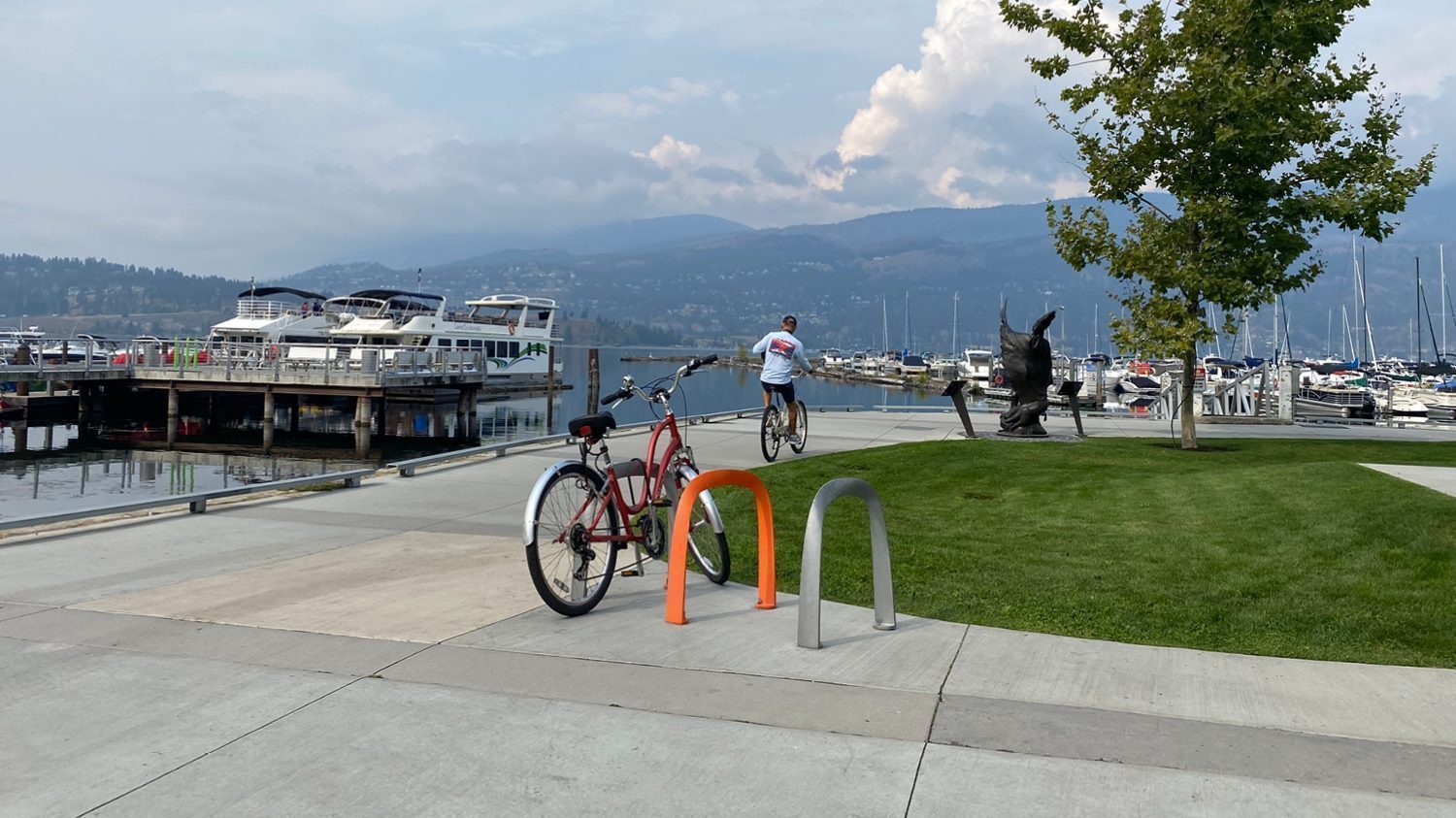 Bright orange and silver SC Bike Racks with an ocean view in Kelowna BC